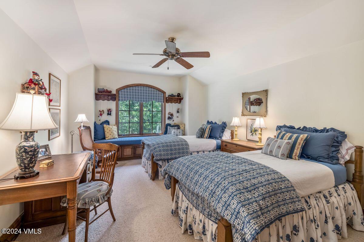 2286 Daybreak Ridge Road Avon, CO 81620 - Photo 19 of 33 a bedroom with double bed windows and a potted plant