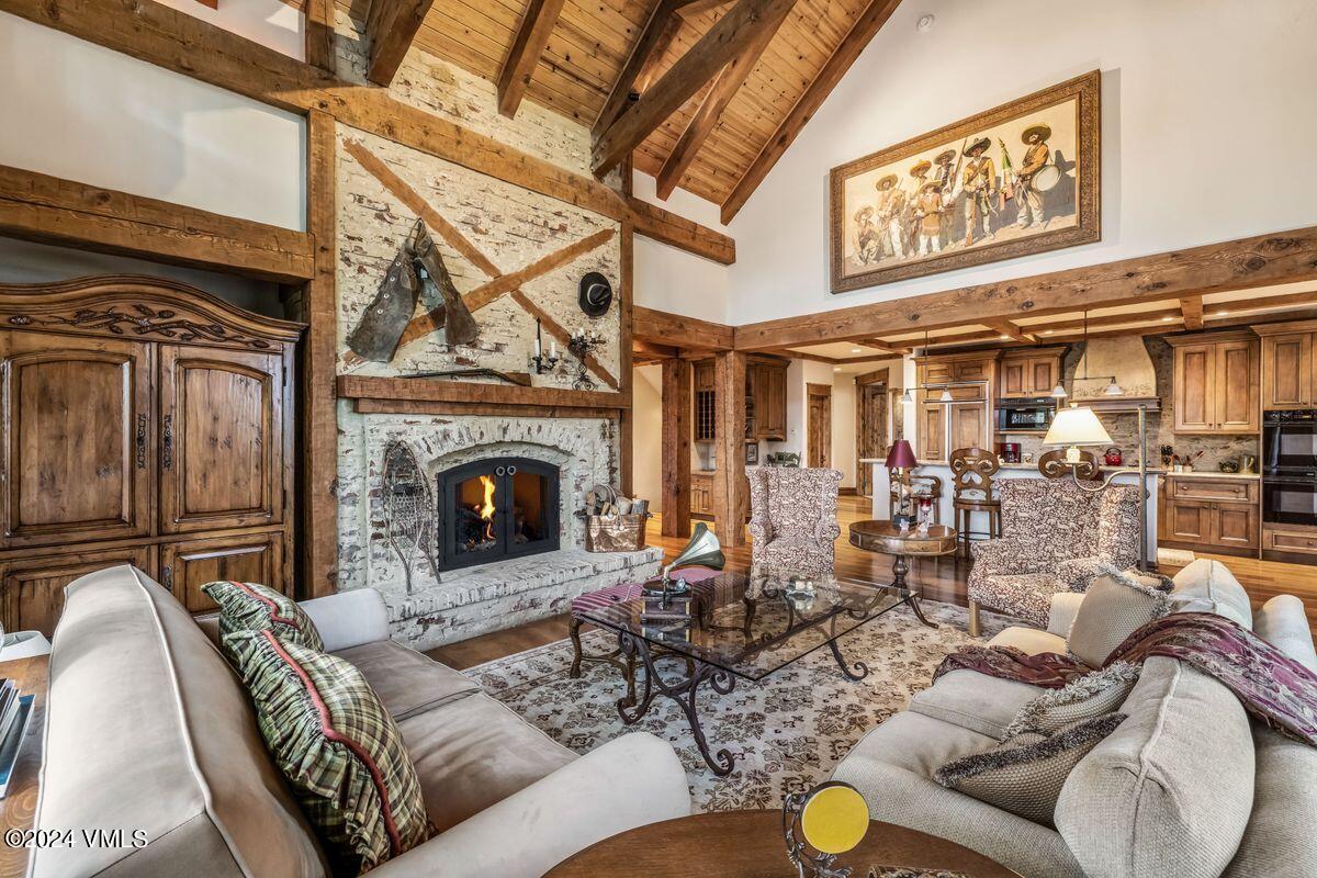 2286 Daybreak Ridge Road Avon, CO 81620 - Photo 7 of 33 a living room with furniture and a fireplace