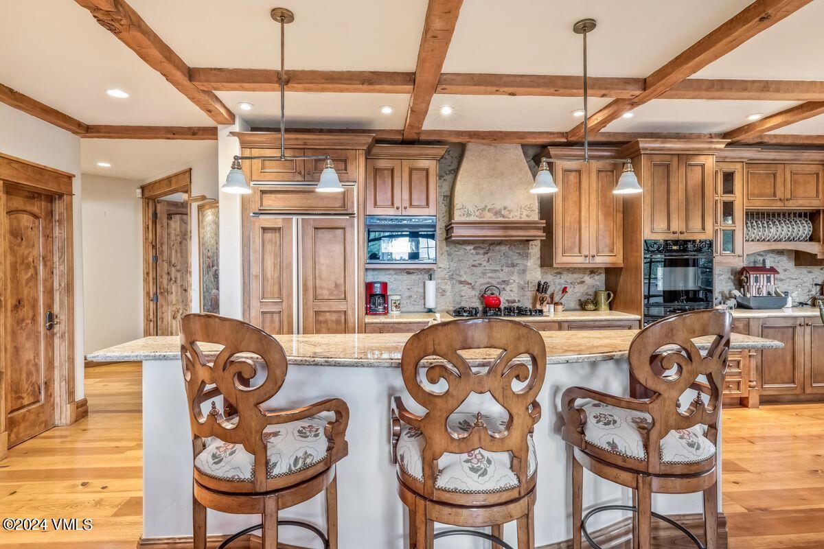 2286 Daybreak Ridge Road Avon, CO 81620 - Photo 9 of 33 a dining table chairs and a kitchen view