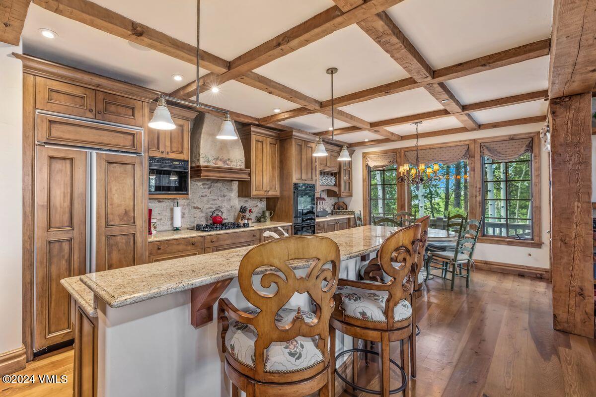 2286 Daybreak Ridge Road Avon, CO 81620 - Photo 10 of 33 a view of a dining room with furniture window and wooden floor