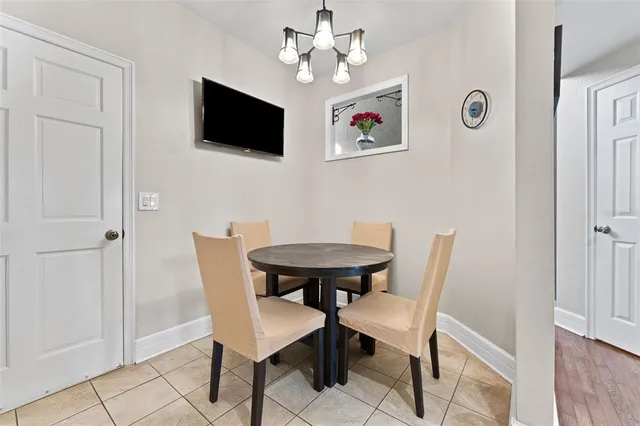 a view of a livingroom with furniture and a flat screen tv