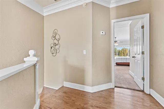 a view of an empty room and wooden floor