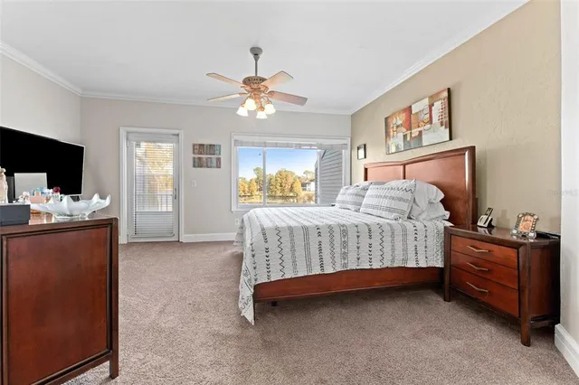 a bedroom with a bed dresser and wooden floor