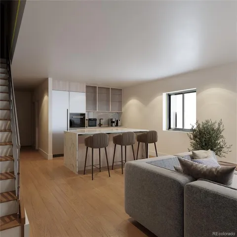 a living room with furniture kitchen and a window