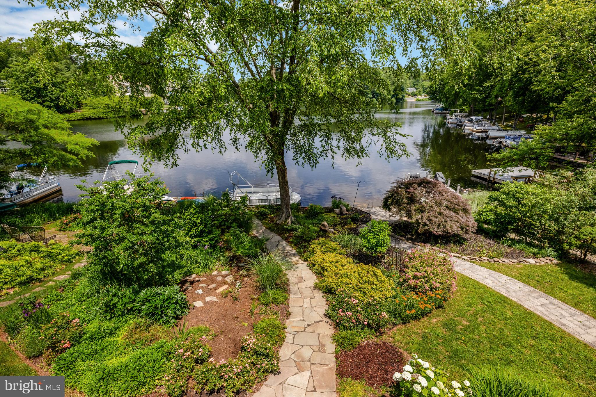11064 Thrush Ridge Road Reston, VA 20191 - Photo 30 of 85 A view of the walkway, lake & landscaping.