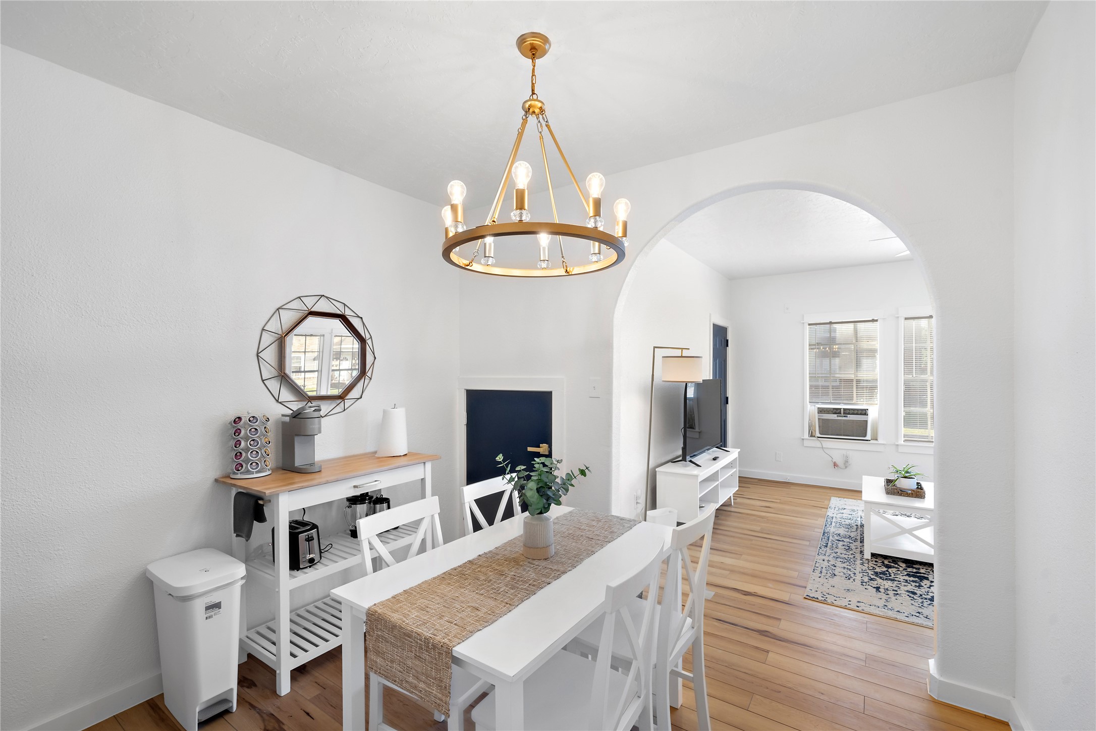 3901 Dallas Street, Unit B Houston, TX 77023 - Photo 9 of 32 a view of a dining room with furniture a chandelier and wooden floor
