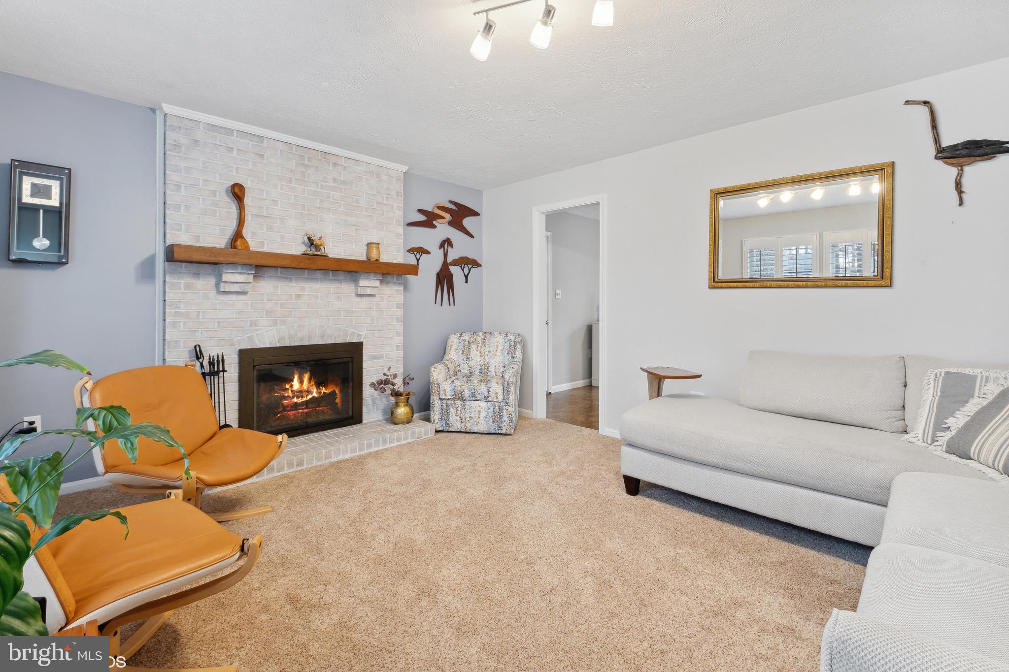 12934 Parran Drive Lusby, MD 20657 - Photo 11 of 21 a living room with furniture and a fireplace