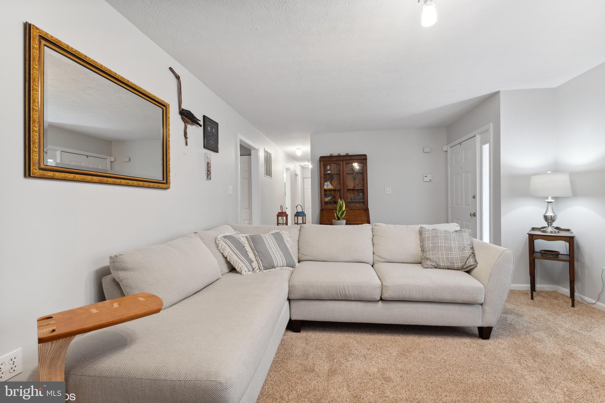 12934 Parran Drive Lusby, MD 20657 - Photo 12 of 21 a living room with furniture and a painting