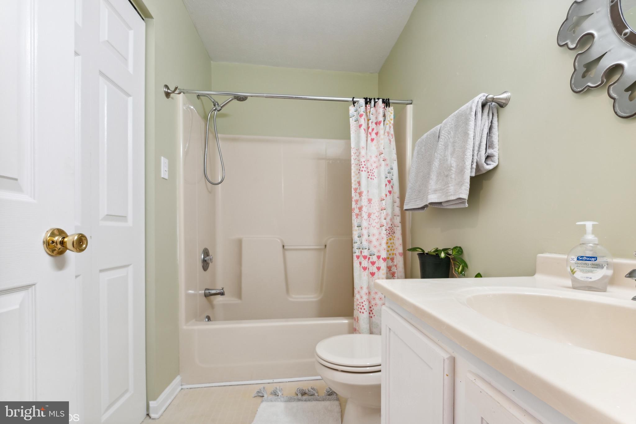 12934 Parran Drive Lusby, MD 20657 - Photo 17 of 21 a bathroom with a sink a toilet and shower