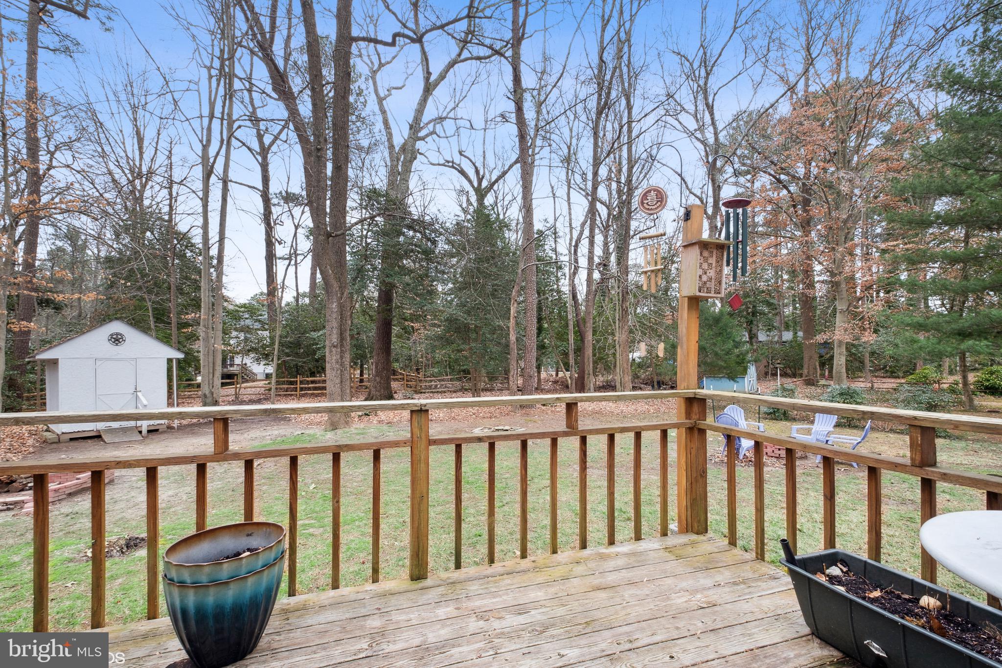 12934 Parran Drive Lusby, MD 20657 - Photo 19 of 21 a balcony with wooden floor and outdoor seating