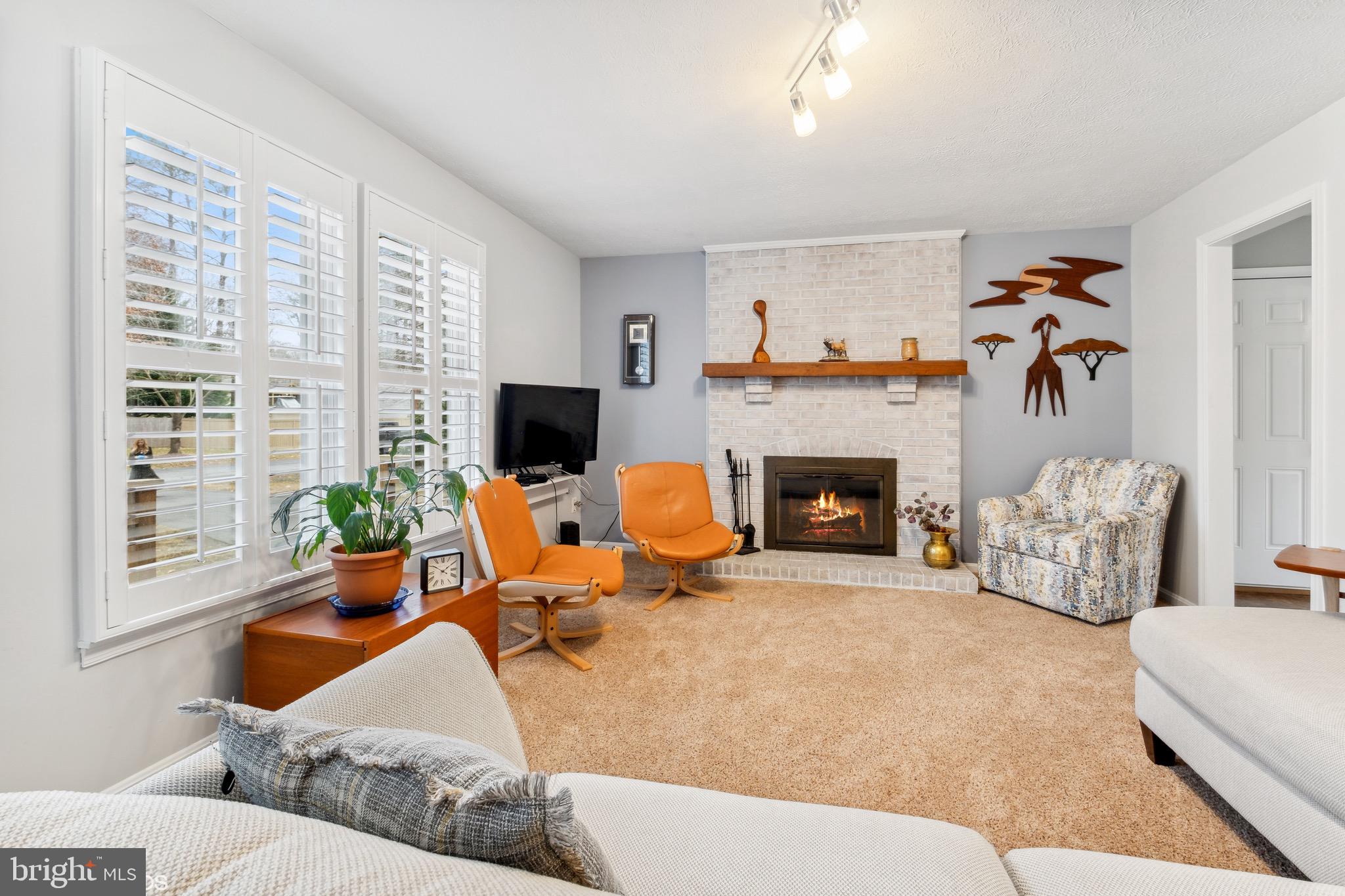 12934 Parran Drive Lusby, MD 20657 - Photo 7 of 21 a living room with furniture and a fireplace