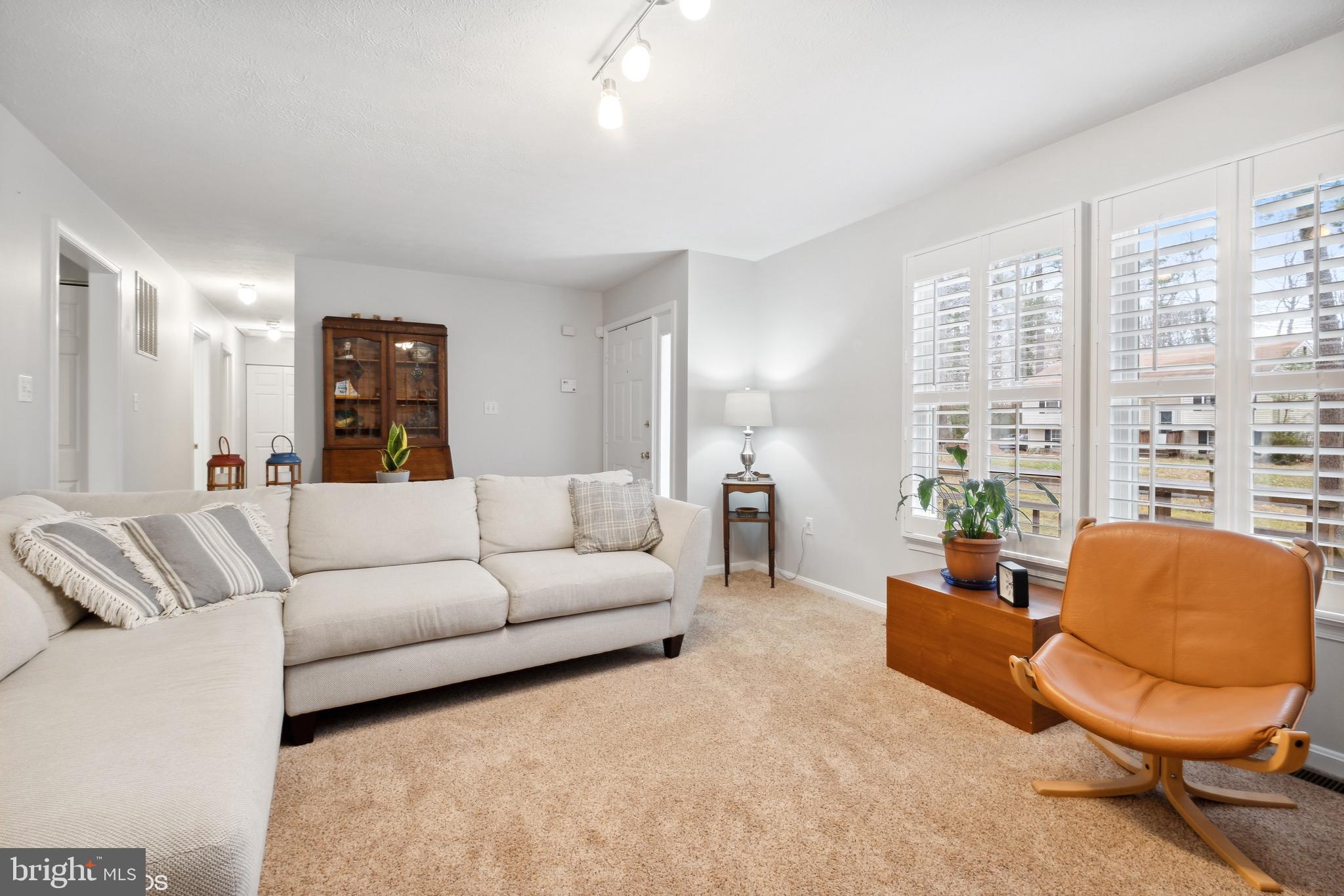 12934 Parran Drive Lusby, MD 20657 - Photo 9 of 21 a living room with furniture and a large window