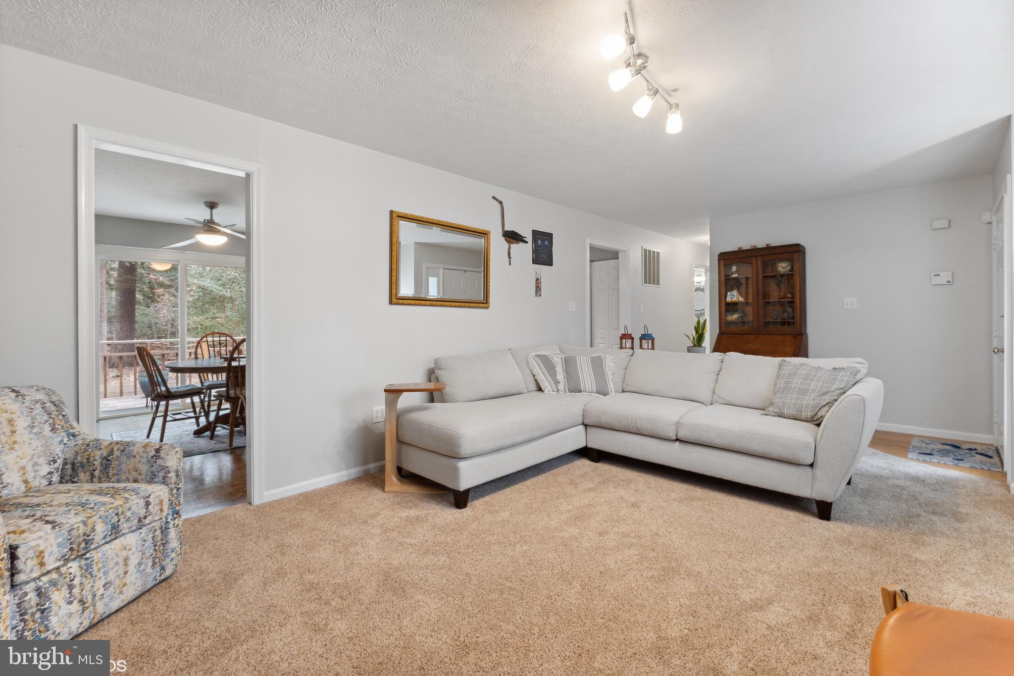 12934 Parran Drive Lusby, MD 20657 - Photo 10 of 21 a living room with furniture and a large window