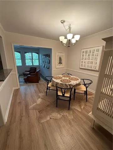 a view of a kitchen with a dishwasher cabinets and wooden floor