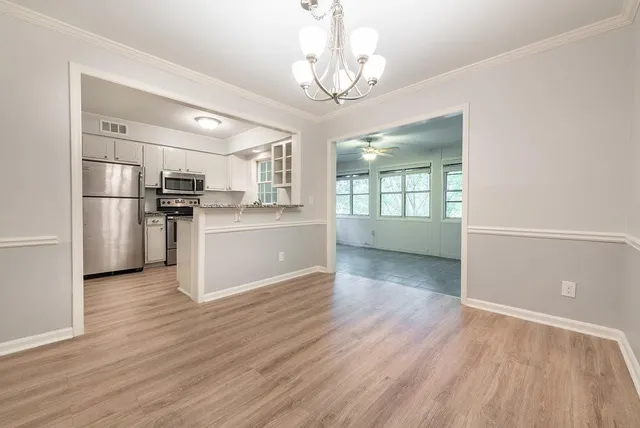 a view living room with granite countertop cabinets and wooden floor