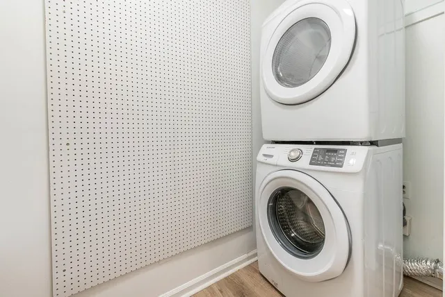 a bathroom with a granite countertop sink a toilet and a mirror