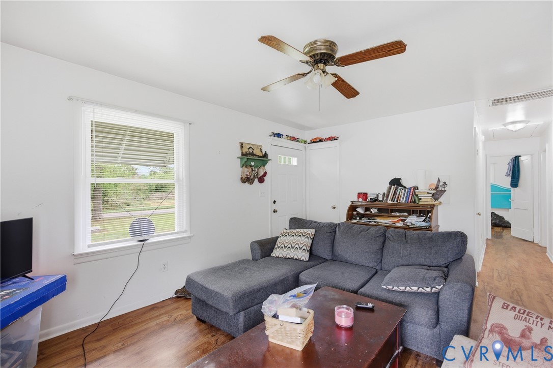 3590 Belle Meade Road Bumpass, VA 23024 - Photo 6 of 20 a living room with furniture and a window