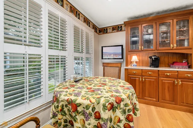 a spacious bathroom with a double vanity sink mirror and next to a large window