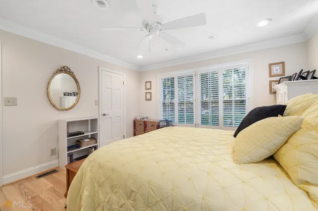 a bedroom with furniture and a fireplace