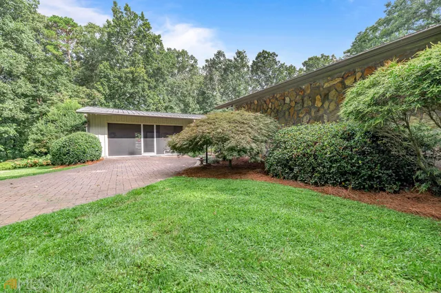 a front view of a house with garden