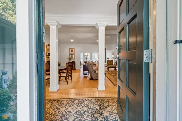 a view of a dining room with furniture window and outside view