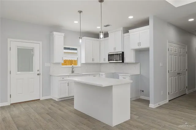 a bathroom with a double vanity sink mirror and shower