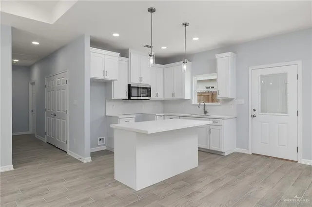 a large kitchen with cabinets