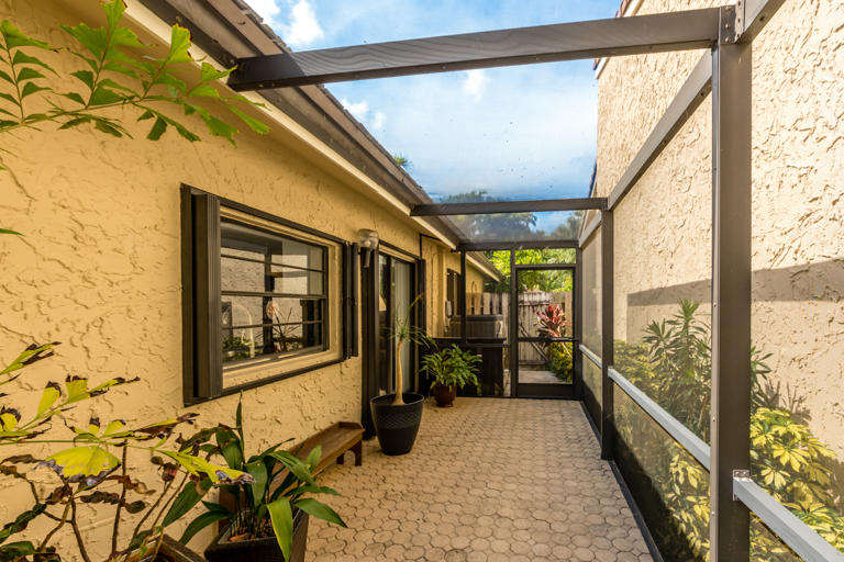 6356 Pond Apple Road Boca Raton, FL 33433 - Photo 22 of 26 6356 Pond Apple Side Patio