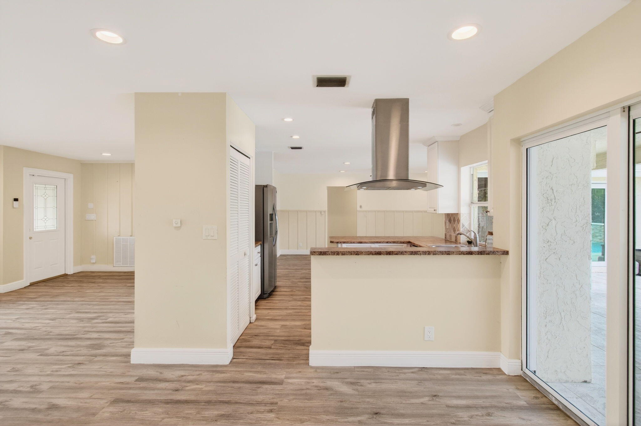 6063 Golf Vista Way Boca Raton, FL 33433 - Photo 20 of 52 a kitchen with stainless steel appliances granite countertop a stove and a refrigerator