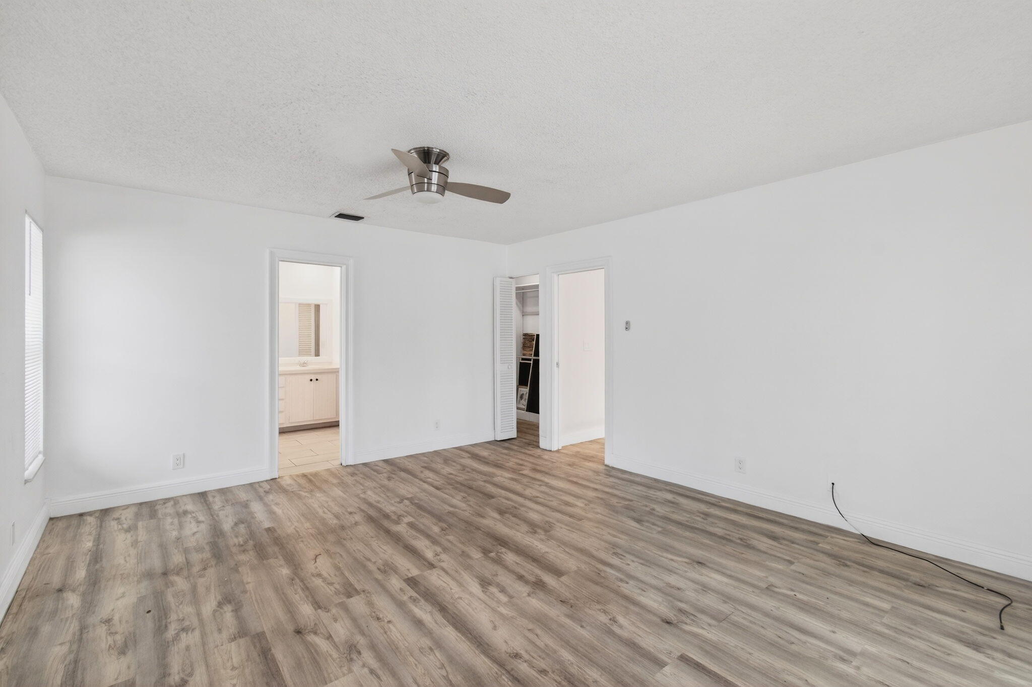 6063 Golf Vista Way Boca Raton, FL 33433 - Photo 24 of 52 a view of a room with wooden floor