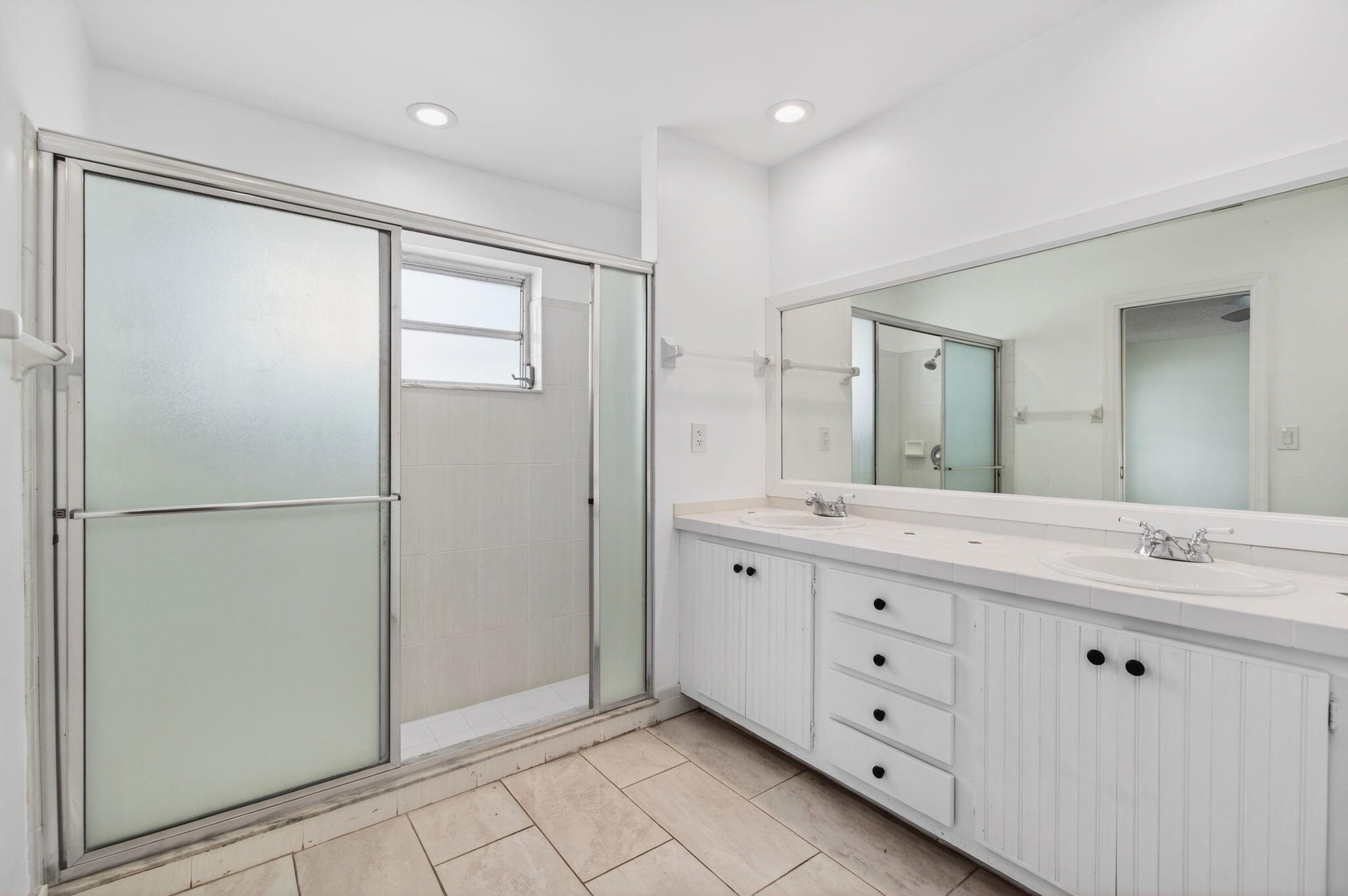 6063 Golf Vista Way Boca Raton, FL 33433 - Photo 27 of 52 a spacious bathroom with a granite countertop sink mirror and double