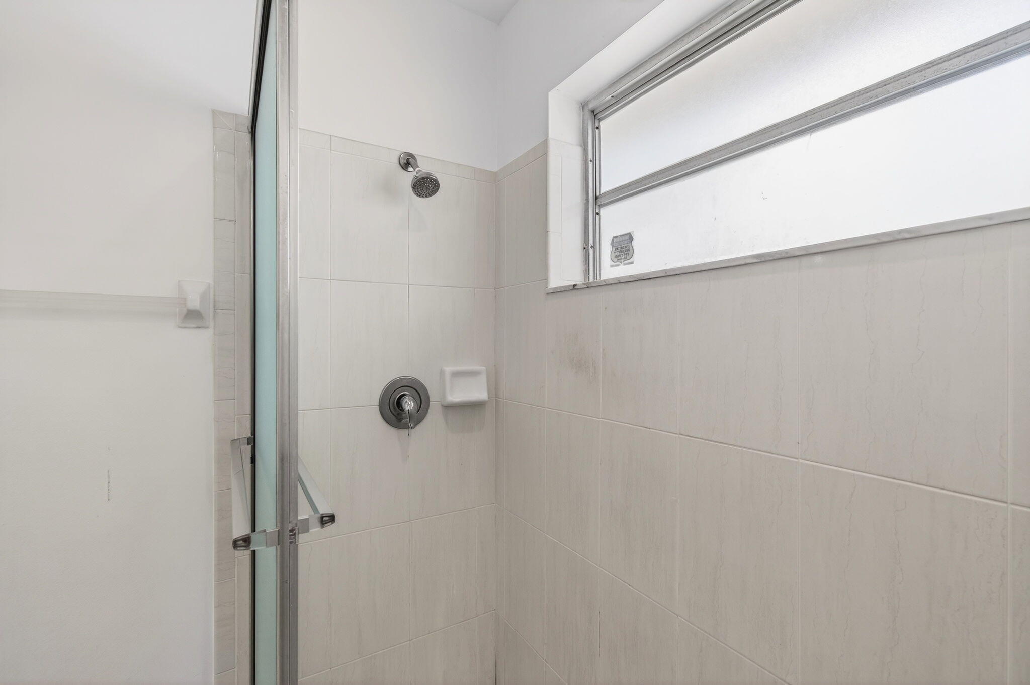 6063 Golf Vista Way Boca Raton, FL 33433 - Photo 28 of 52 a bathroom with a shower