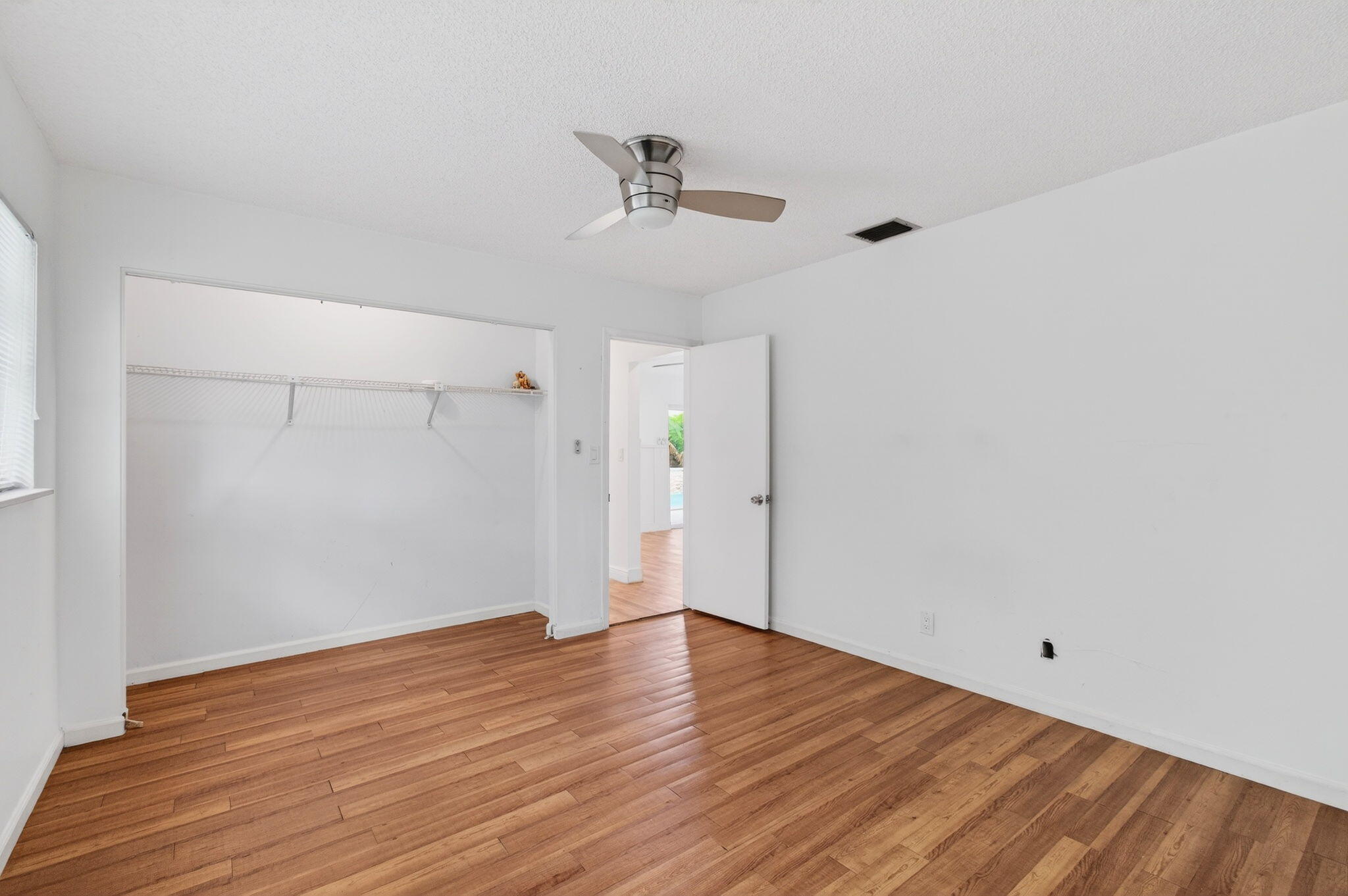 6063 Golf Vista Way Boca Raton, FL 33433 - Photo 32 of 52 wooden floor in an empty room