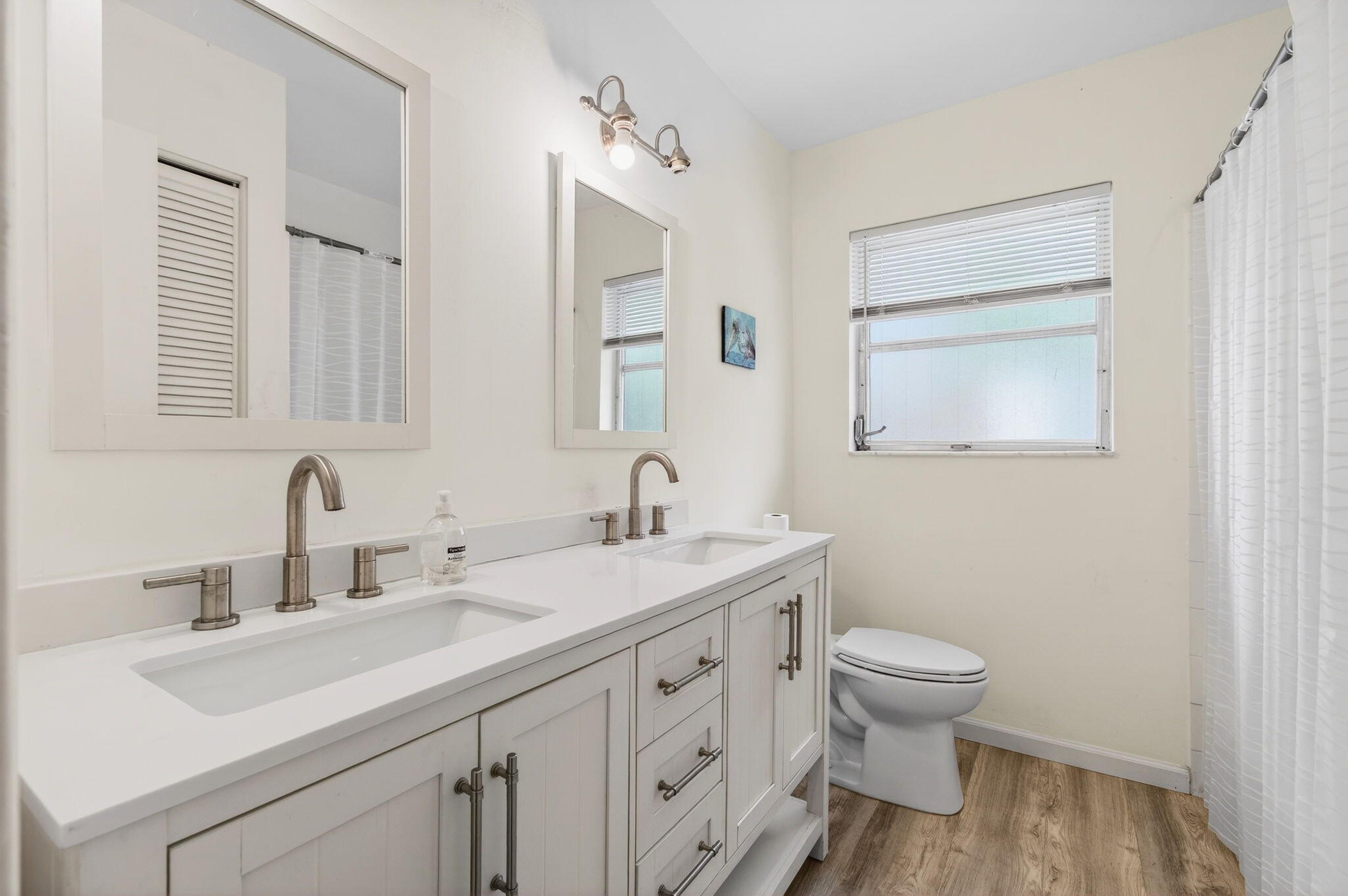 6063 Golf Vista Way Boca Raton, FL 33433 - Photo 33 of 52 a bathroom with a toilet sink and mirror