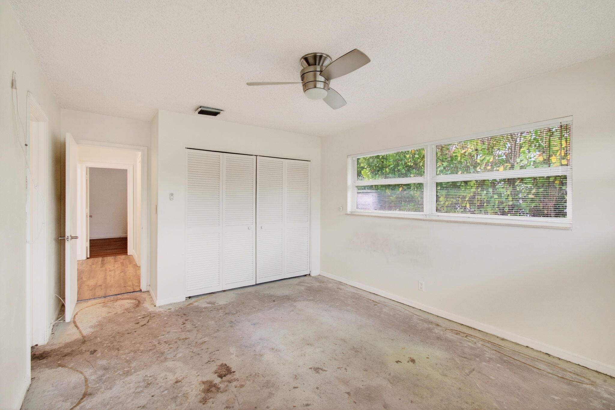 6063 Golf Vista Way Boca Raton, FL 33433 - Photo 35 of 52 an empty room with a empty space and windows