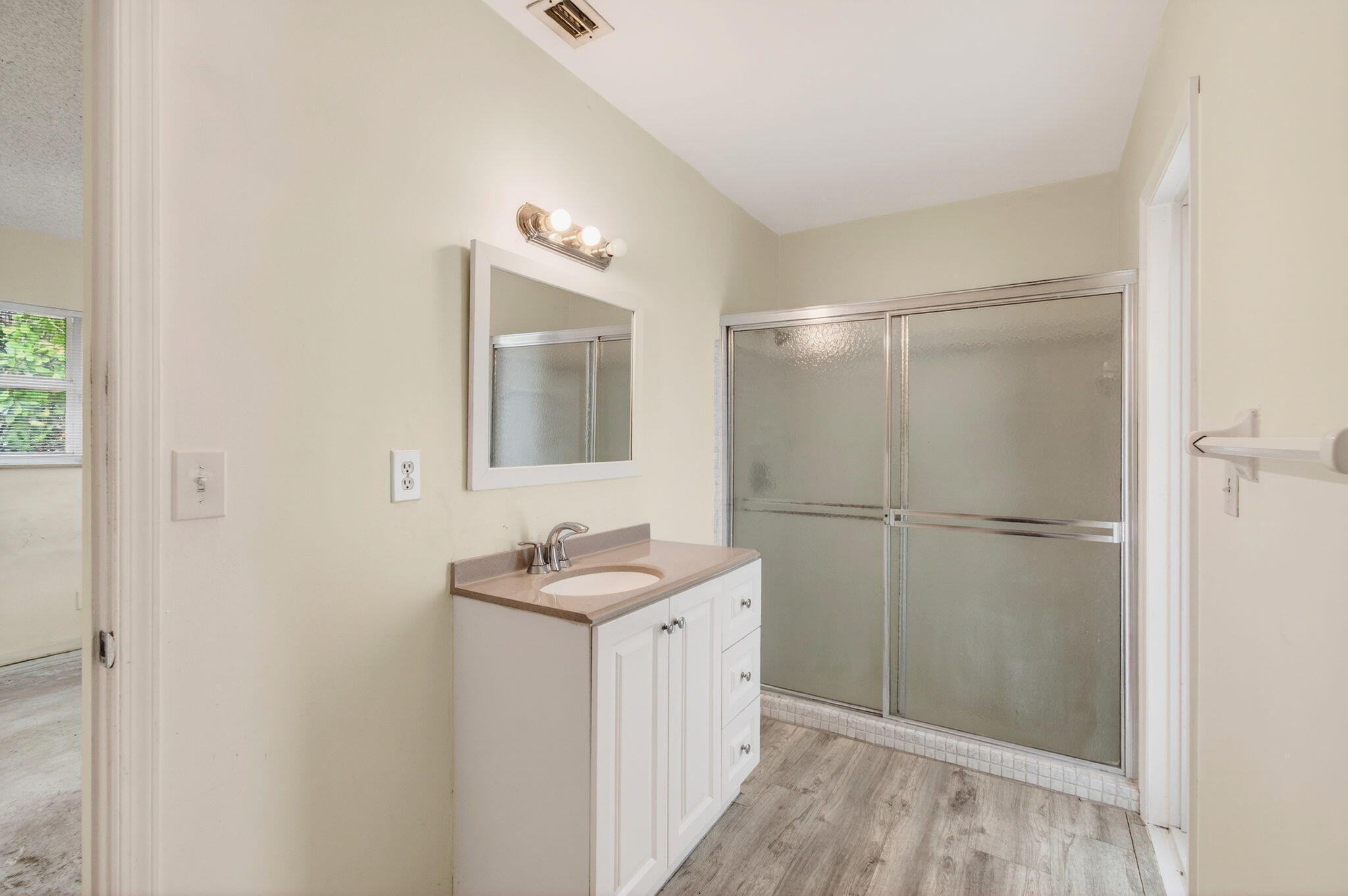 6063 Golf Vista Way Boca Raton, FL 33433 - Photo 36 of 52 a bathroom with a sink and mirror