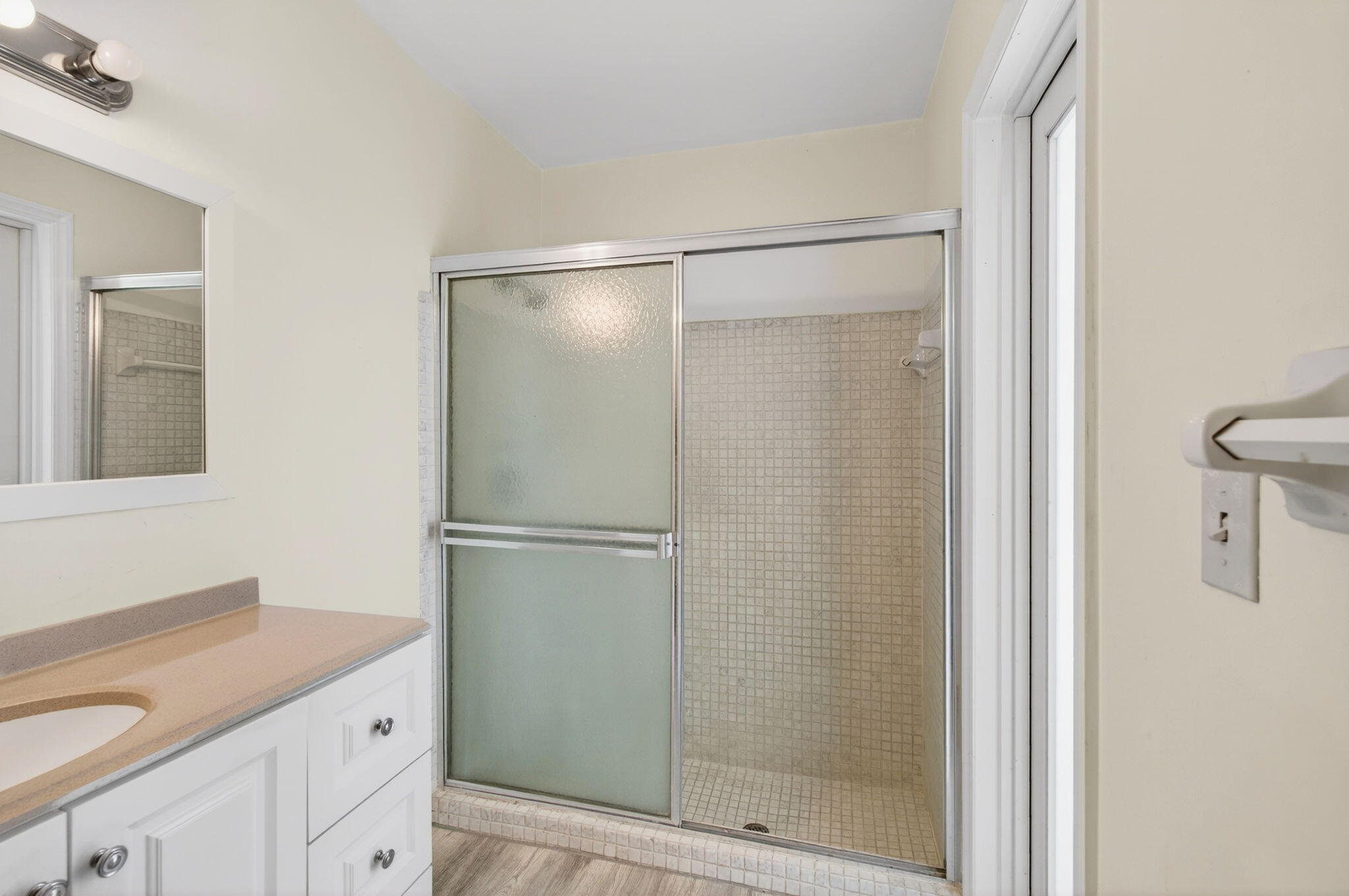 6063 Golf Vista Way Boca Raton, FL 33433 - Photo 37 of 52 a bathroom with a shower sink vanity and mirror