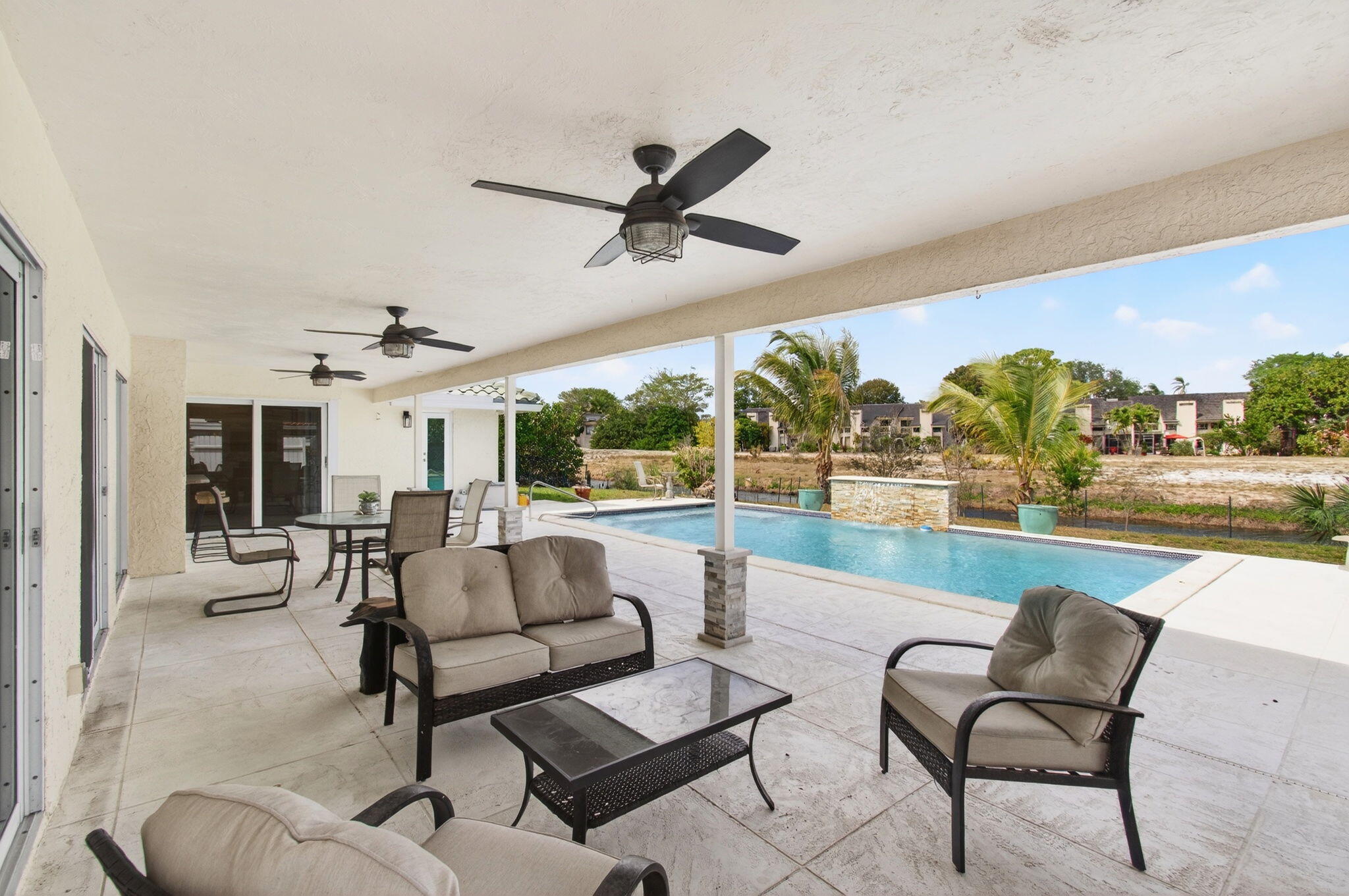 6063 Golf Vista Way Boca Raton, FL 33433 - Photo 40 of 52 a living room with furniture and a large window