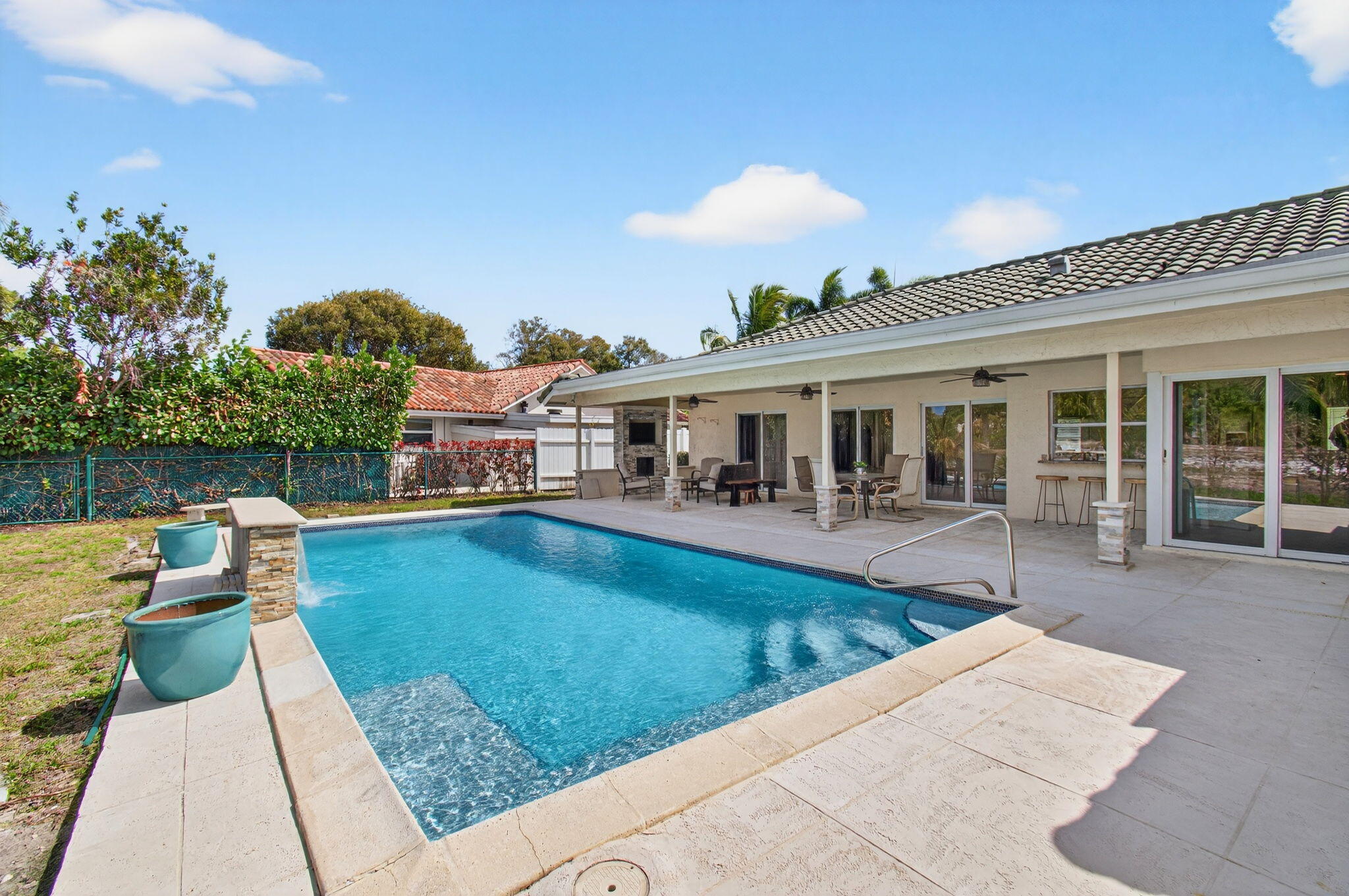 6063 Golf Vista Way Boca Raton, FL 33433 - Photo 43 of 52 swimming pool view with a seating space and garden view