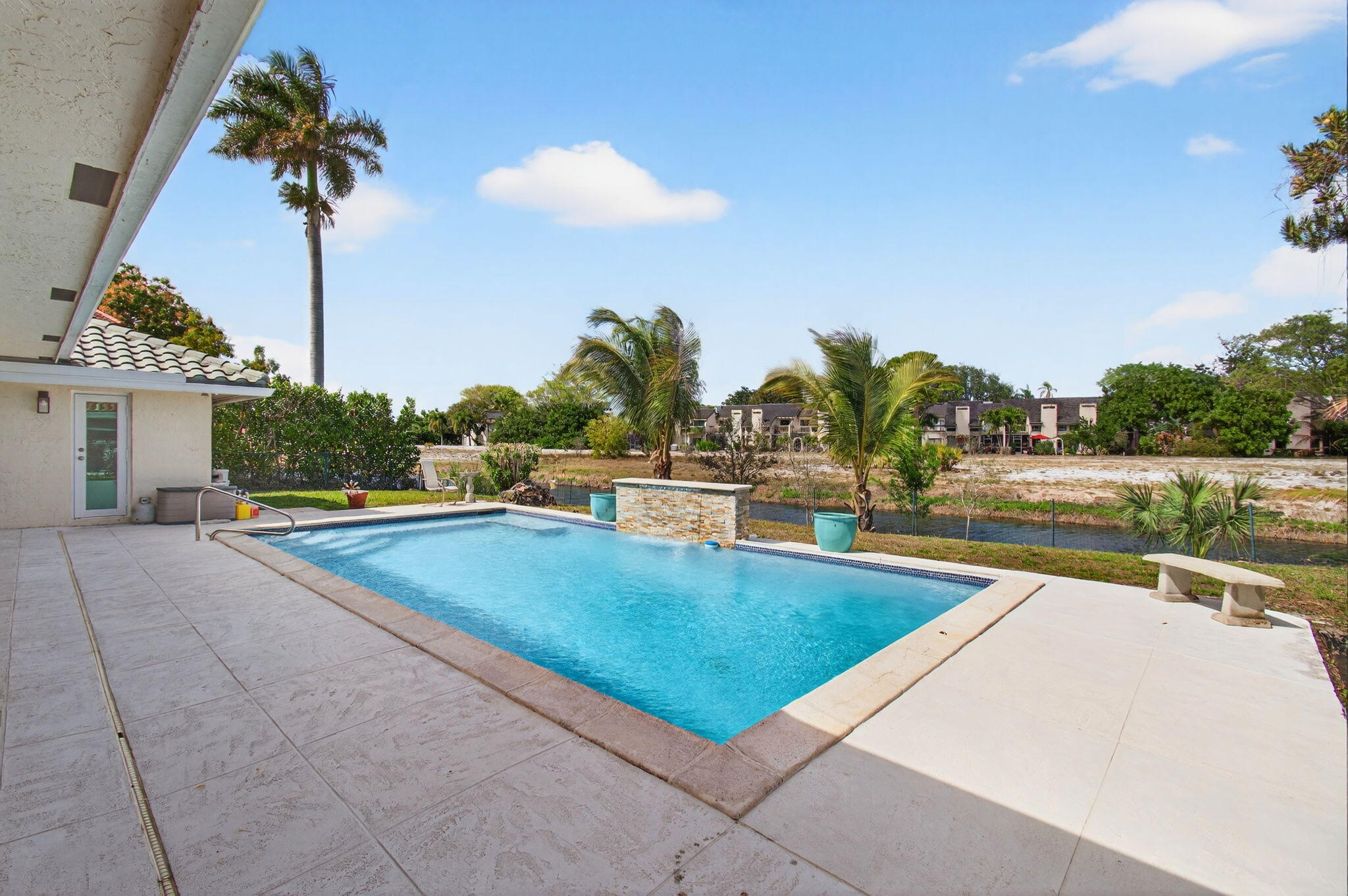 6063 Golf Vista Way Boca Raton, FL 33433 - Photo 44 of 52 a view of a swimming pool and a yard