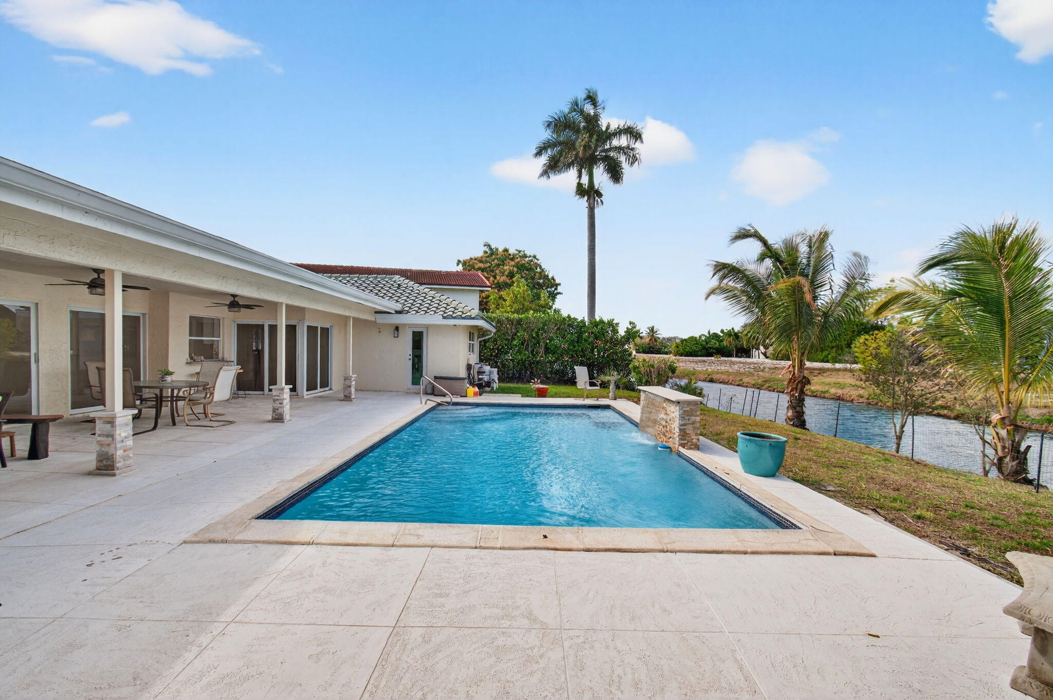6063 Golf Vista Way Boca Raton, FL 33433 - Photo 45 of 52 a view of a house with backyard and swimming pool
