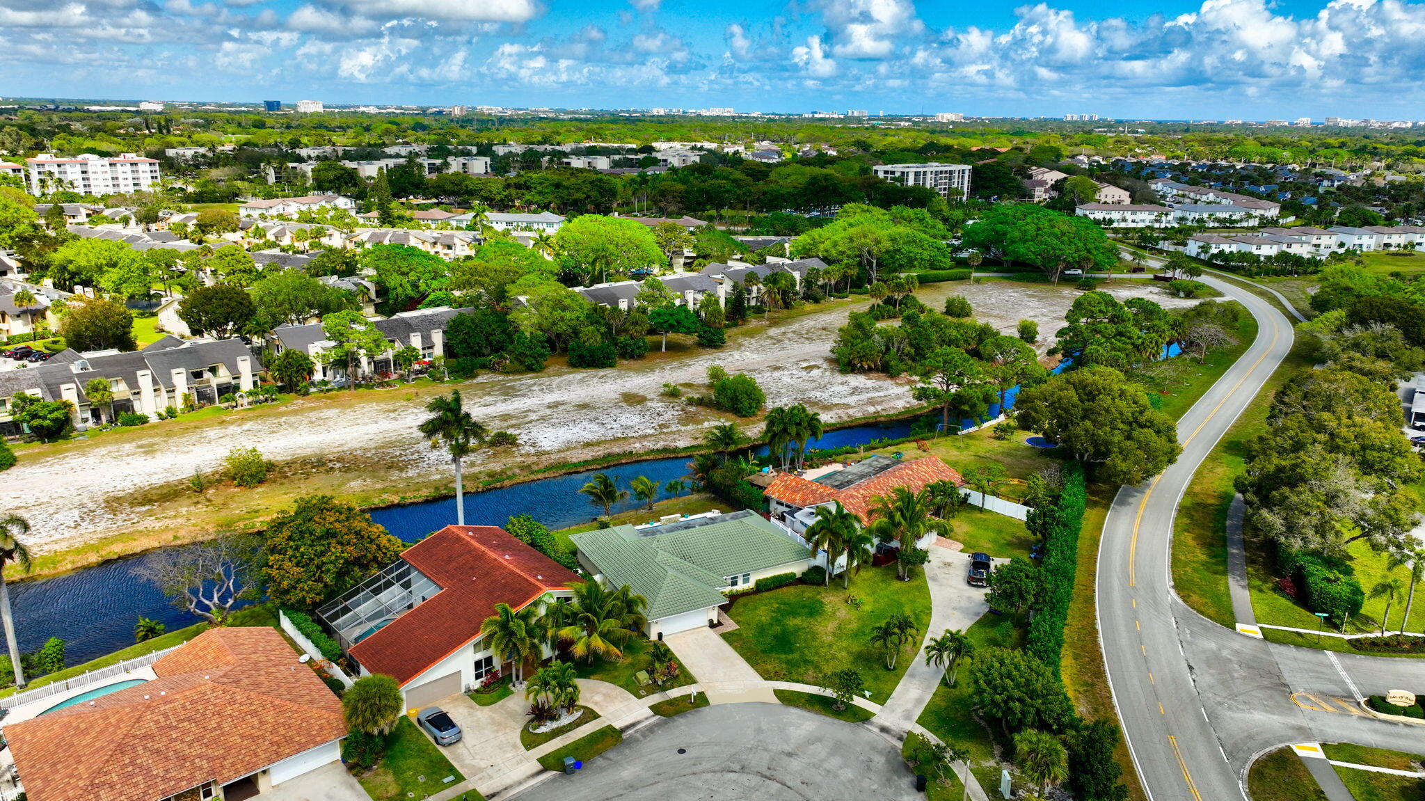 6063 Golf Vista Way Boca Raton, FL 33433 - Photo 52 of 52 an aerial view of residential houses with outdoor space and swimming pool