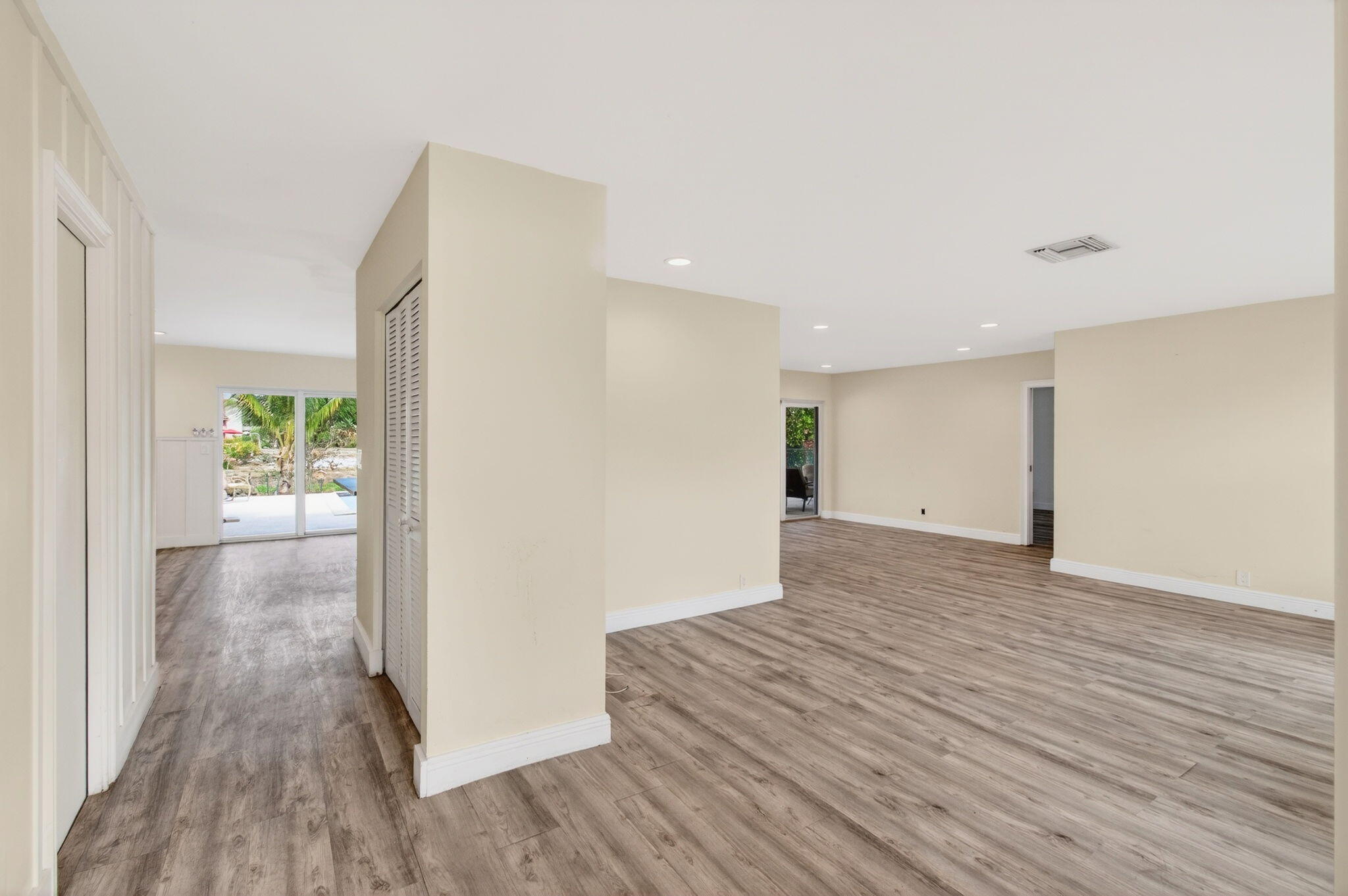 6063 Golf Vista Way Boca Raton, FL 33433 - Photo 6 of 52 a view of a hallway with wooden floor