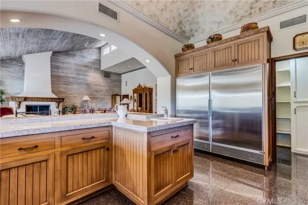 a kitchen with stainless steel appliances granite countertop a stove and a sink