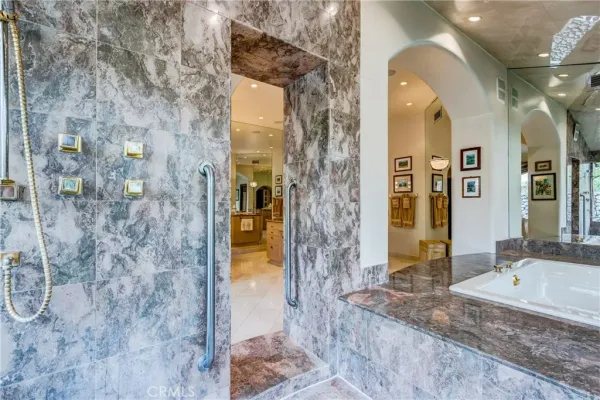 a bed room with furniture and a large window