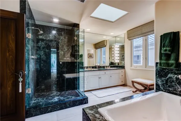 a utility room with cabinets washer and dryer