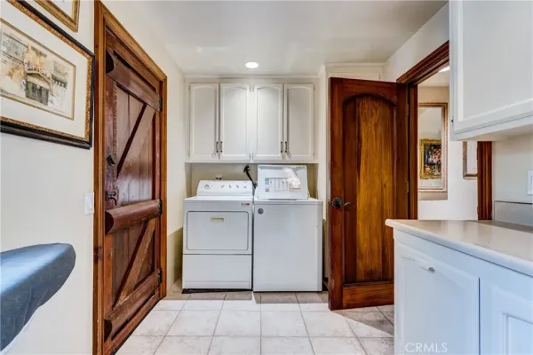a spacious bathroom with a granite countertop sink and a mirror