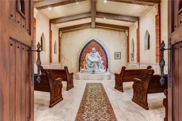 a living room with stainless steel appliances kitchen island granite countertop furniture and a large window