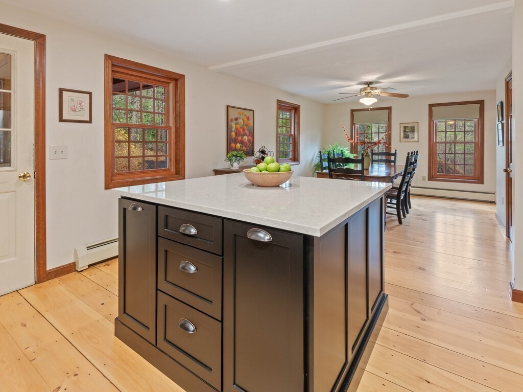 532 B Hubbardston Road Princeton, MA 01541 - Photo 11 of 41 a kitchen with a stove a sink a dining table and chairs