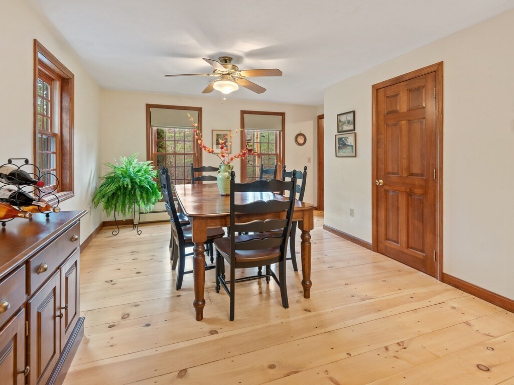 532 B Hubbardston Road Princeton, MA 01541 - Photo 12 of 41 a dining room with furniture potted plants and wooden floor